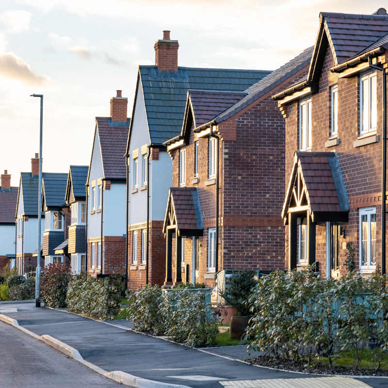Image of house buyer being handed keys to their new home