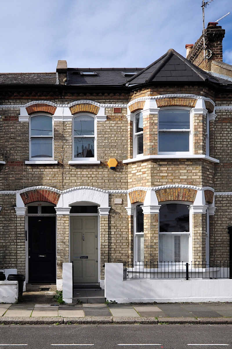 Image of house buyer being handed keys to their new home